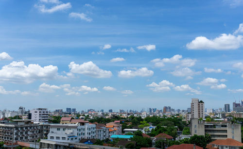 Buildings in city against sky