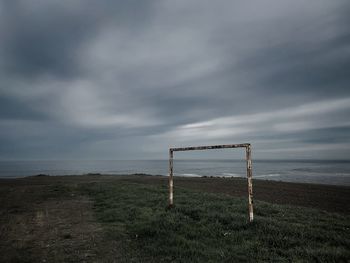 Rural soccer field near the sea on a dark day