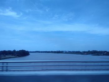 Scenic view of lake against blue sky