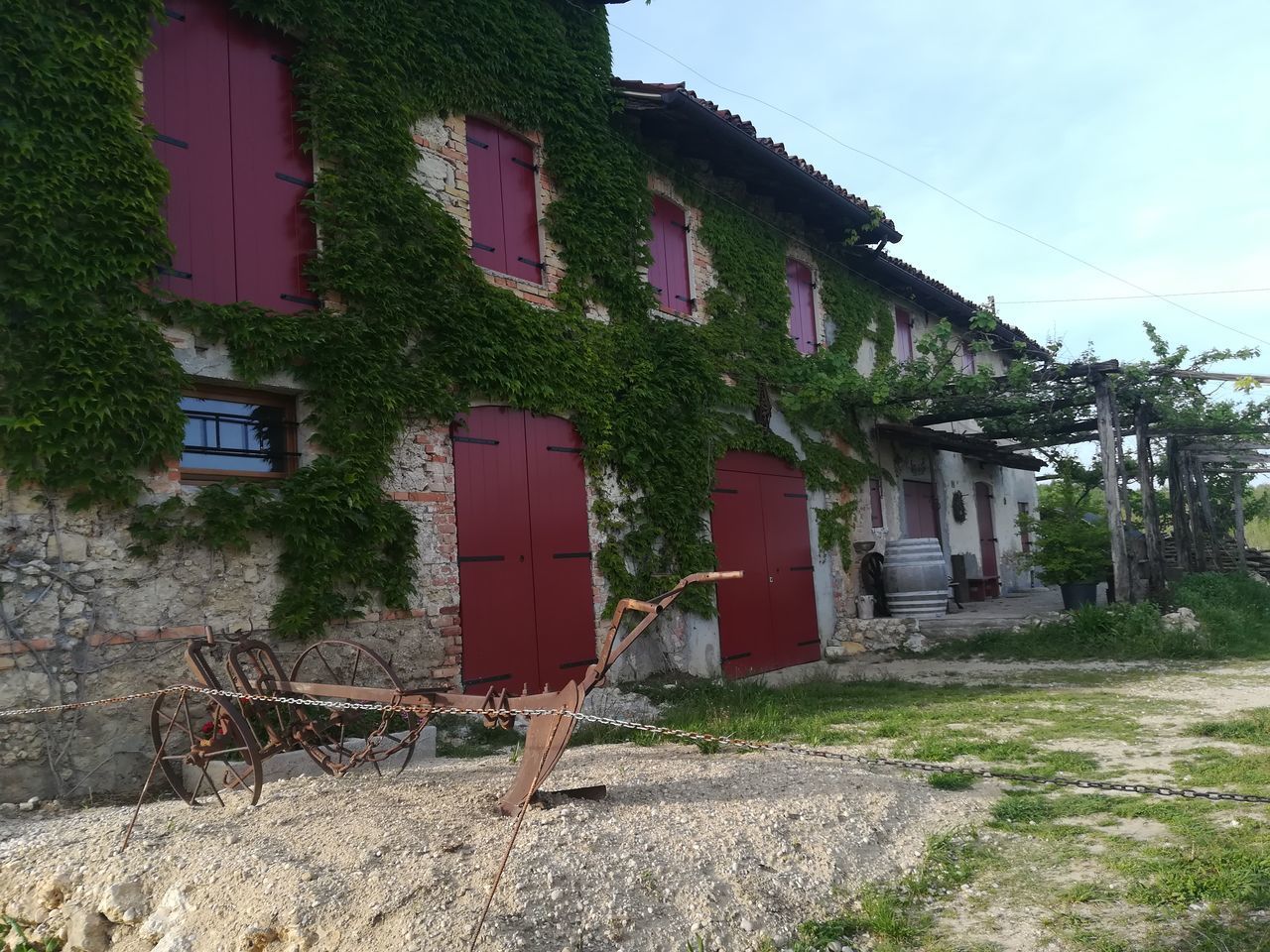 ABANDONED HOUSE BY BUILDINGS IN CITY