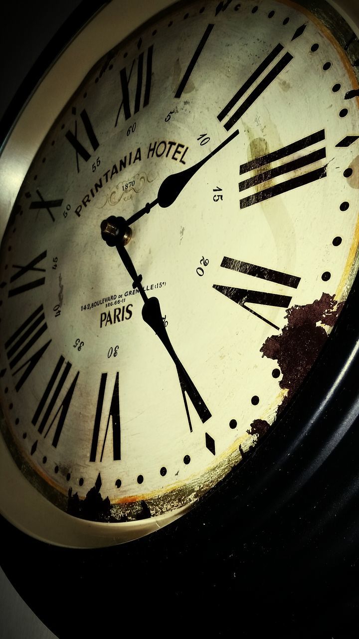 time, clock, text, number, communication, indoors, clock face, accuracy, close-up, instrument of time, western script, minute hand, wall clock, circle, old-fashioned, low angle view, roman numeral, part of, no people, single object