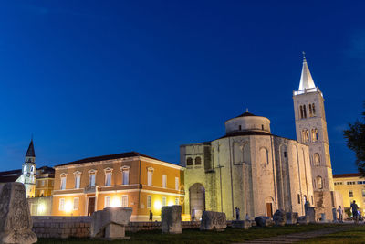 Low angle view of church against clear blue sky