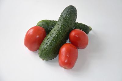 Close-up of tomatoes against white background