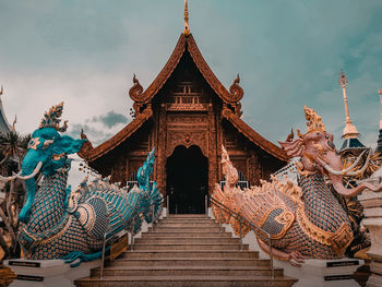 Statue of temple against building