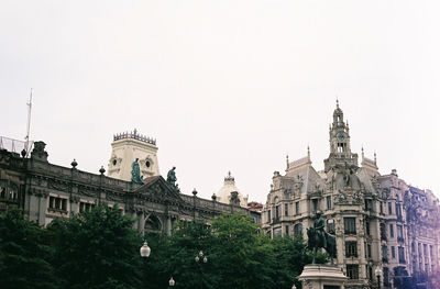 Low angle view of buildings against clear sky