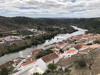 High angle view of townscape by river