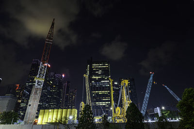 Low angle view of illuminated buildings against sky