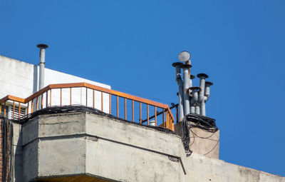 Low angle view of street light against clear blue sky