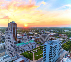 Cityscape against sky during sunset