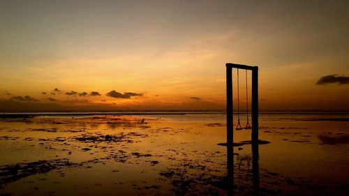 Scenic view of sea at sunset