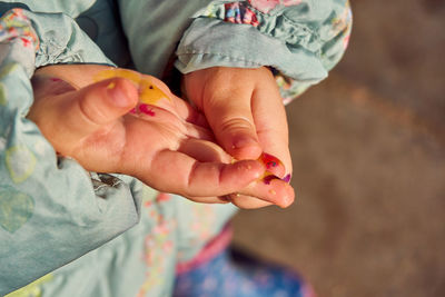 Close-up of woman holding hands