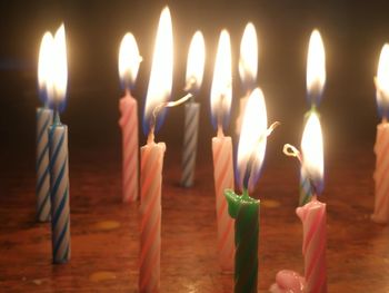 Close-up of burning candles on birthday cake