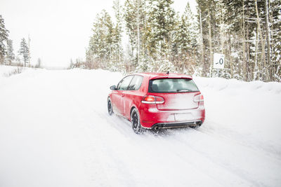 Car on snow covered land