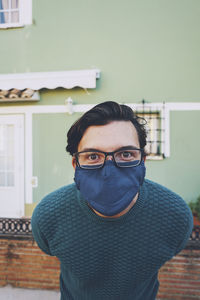 Portrait of man wearing mask standing outdoors