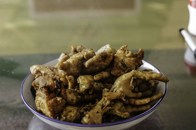 Close-up of meat in bowl on table