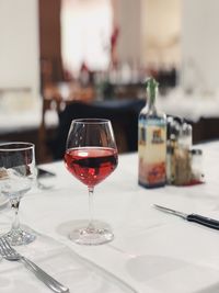 Close-up of red wine in glass on table