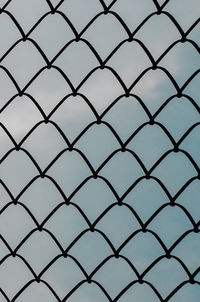 Low angle view of chainlink fence