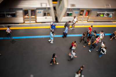 High angle view of people walking on road