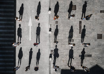 High angle view of people walking on street