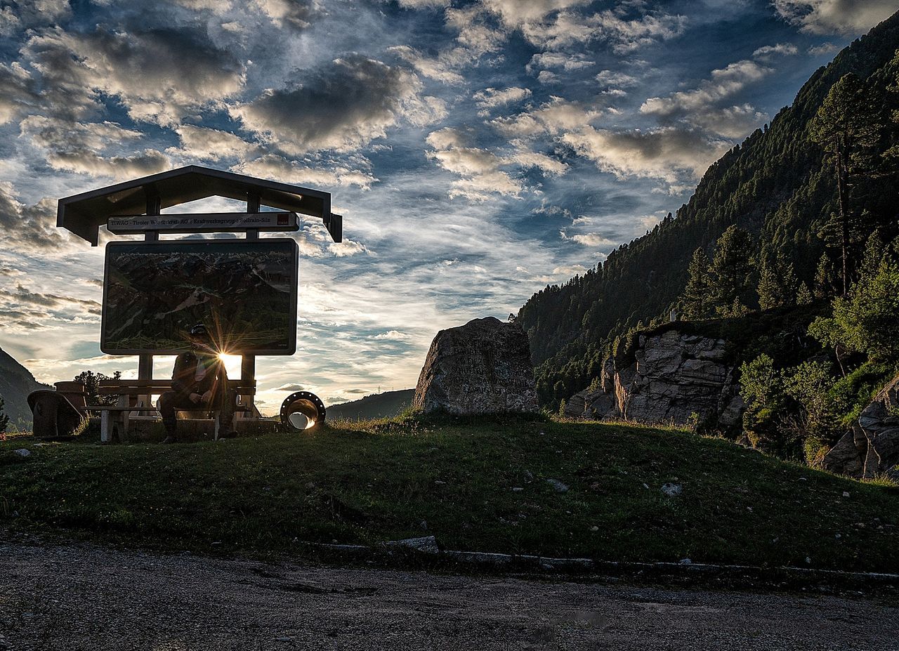 cloud - sky, sky, nature, architecture, built structure, land, rock, grass, solid, no people, rock - object, outdoors, tranquility, scenics - nature, hut, plant, building exterior, tourism, travel, building