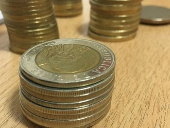 Close-up of coins on table