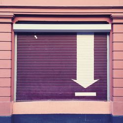 Arrow symbol on shutter of a store