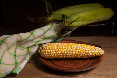 Close-up of corn on table