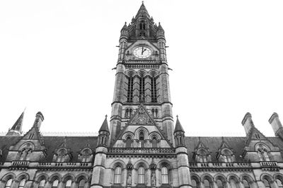 Low angle view of clock tower against sky