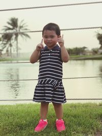 Cute boy standing in grass