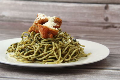 Close-up of noodles in plate on table