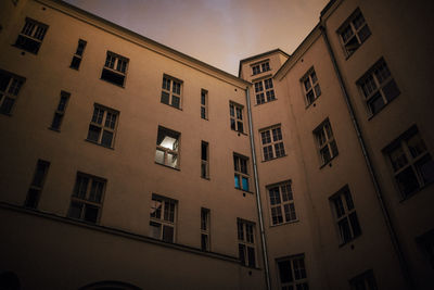 Low angle view of building against sky at dusk