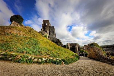 Low angle view of rocks against sky