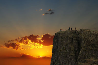 Scenic view of rock formations against sky during sunset