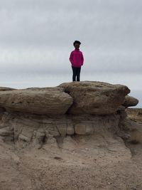 Woman standing on rock