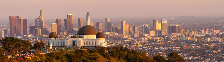 Panoramic view of buildings in city against sky