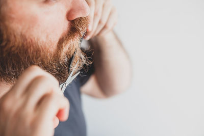 Close-up of man hand over white background