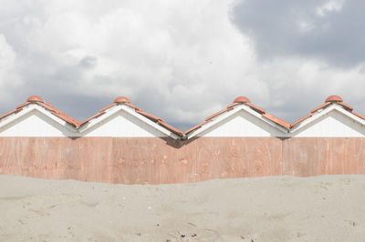 View of built structure on beach against sky