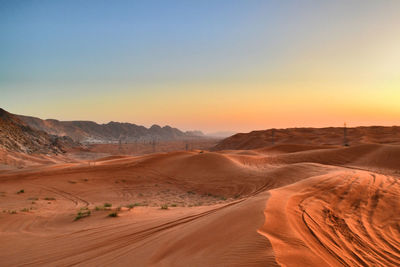 Scenic view of desert against clear sky