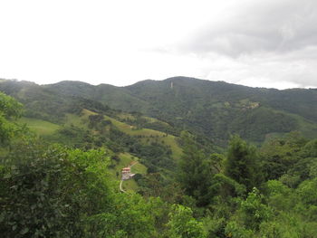 High angle view of green landscape against sky