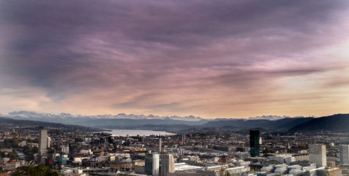 High angle shot of townscape against sky at sunset