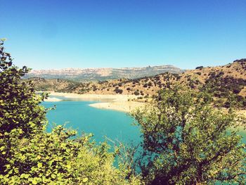 Scenic view of landscape against clear blue sky