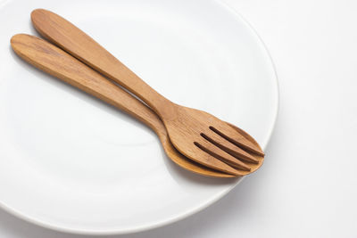 High angle view of bread on white table