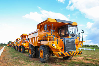 Low angle view of tractor against sky