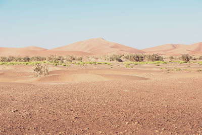 Scenic view of desert against clear sky