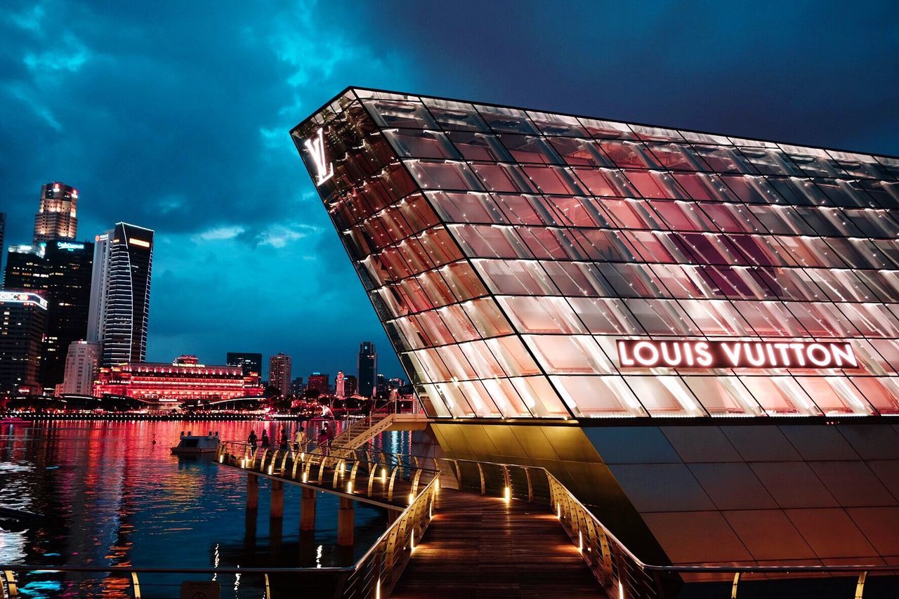 architecture, building exterior, sky, built structure, outdoors, cloud - sky, water, reflection, night, travel destinations, illuminated, no people, city, skyscraper, nautical vessel