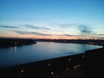 View of calm river at sunset