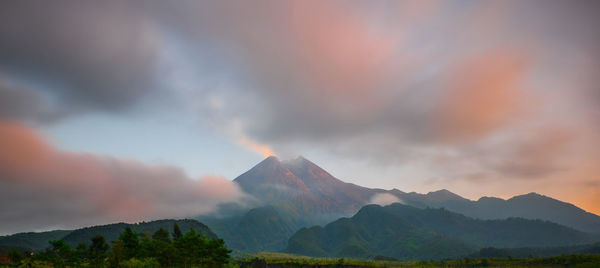 Scenic view of mountains against sky during sunset