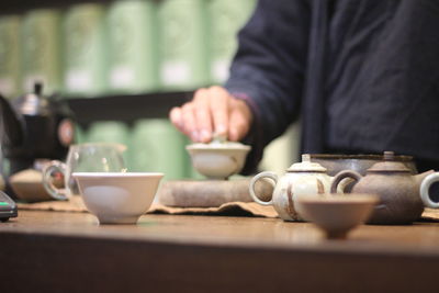 Midsection of woman preparing food on table