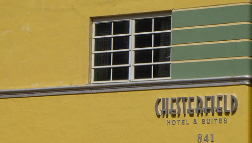 Close-up of yellow window on building