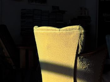 Close-up of yellow sofa at home